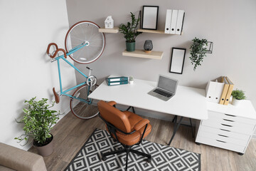 Poster - interior of home office with bicycle, workplace and plants