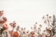 © btiger - delicate arrangement of soft pink and peach flowers and leafy branches laid out on a light wooden surface creating a gentle and serene mood