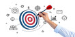 © kazi - Achieve your goals with precise aim, a skilled hand guides the dart to the bullseye on a strategic target