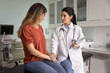 © fizkes - Empathetic young doctor woman touching hands of frustrated depressed patient, giving support, comfort, compassion after telling bad healthcare news about health problems, motivating for getting better
