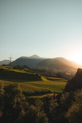 Wall Mural - rolling green hills at sunset