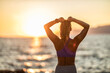 © milanmarkovic78 - Woman Tying Her Hair During Training Near The Sea