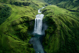 Iceland waterfall Skogafoss in Icelandic nature landscape. Famous tourist attractions and landmarks destination in Icelandic nature landscape on South Iceland. Aerial drone view of top waterfall.