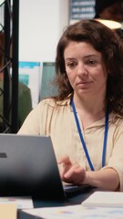 Poster - Vertical Video Businesswoman evaluates key performance metrics and writes reports at her desk, planning financial strategy with her analytical mindset. Professional leadership in business activity