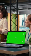 Poster - Vertical Video Powerful businesswomen using a laptop with isolated display, exchanging reports and strategy insights with data visualization. Work environment and productivity in company workspace