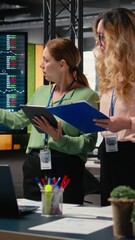 Poster - Vertical Video Goals oriented businesswomen representing strategic collaboration in the office, using tablet and data reports to build strong goals alignment and inspire achievement across company