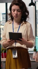 Poster - Vertical Video Female administrator reviewing the performance numbers of her team, evaluating KPI insight for goals alignment and business achievement. Empowered woman with a success story. Camera B.