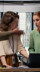 Poster - Vertical Video Diverse team of businesswomen review analytics and refine their vision in a bright and strategic work environment, aligning corporate objectives with career progress and development