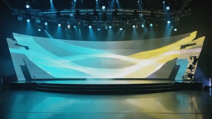 Wall Mural - empty stage in an indoor venue featuring a large led screen displaying abstract graphics, illuminate