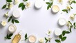 © Abstract Design - Elegant White Cosmetic Bottles Surrounded by Fresh Green Leaves and Delicate Flowers on White Backdrop