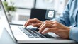 © ranggasae - Closeup of a business person's hands typing on a laptop keyboard, sending an email message. Digital communication and newsletter marketing concept.