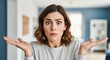 © ruangfootage - Confused Woman Shrugging Shoulders with I Don't Know Expression in a Modern Home