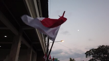 Wall Mural - indonesian flag red and white waves windy under full moon skyline, closeup view