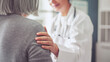 © sebra - Healthy lifestyle and medical concept, the healthcare worker talks to the elderly patient and comforts her