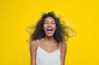 © Nadia - Joyful woman laughing on bright yellow background, positive lifestyle portrait for advertising