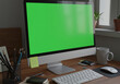 © wiplens - Desktop Computer with Green Screen Display on Modern Home Office Desk