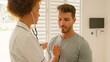 © Monkey Business - Female Nurse Wearing Uniform Listening To Male Patient's Chest In Private Hospital Room