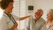 © Monkey Business - Female Nurse Wearing Uniform Giving Senior Couple Good News In Private Hospital Room