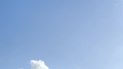Wall Mural - filming of a heavenly landscape with white clouds