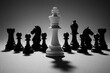 © ParinApril - Strategic plan unfolds as white king stands tall among black pieces in this chess scene