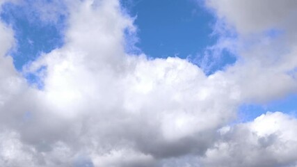 Wall Mural - large cloud white and illuminated clouds cover the entire sky in the afternoon