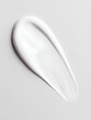 © Jula Isaeva  - White cream smear with smooth texture on light gray background