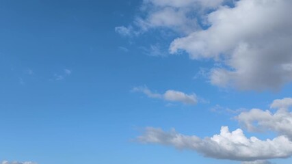 Wall Mural - several clouds forming in the sky in afternoon