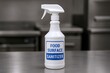 © SERHII - White food surface sanitizer bottle on stainless steel kitchen counter