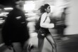 © SERHII - Motion blur of woman running at night in urban setting