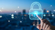 © Hendro - Hand touching a holographic padlock interface with a city background. Concept of access control, digital authentication, and interactive security systems.