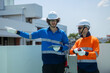© Washburn - Engineers inspecting rooftop electrical equipment
