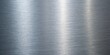 © Jamshadul - Sleek brushed metal texture background with a modern and industrial feel, perfect for adding a touch of sophistication and elegance to any design