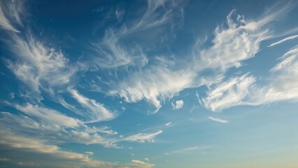 Wall Mural - a bright blue sky hosts shifting cirrostratus clouds in a smooth, continuous drift. timelapse captur