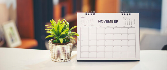 Wall Mural - desktop calendar and cactus placed on student wooden desk in living room, calender for planner to pl