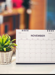 Wall Mural - desktop calendar and cactus placed on student wooden desk in living room, calender for planner to pl