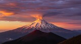 A breathtaking view of Popocatepetl volcano with snow-capped peak and dramatic sunset clouds in Mexico - scenic perspective