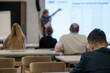 © Anton Gvozdikov - Audience attending business presentation. Professional environment with speaker in focus offering key insights.