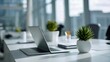 © Generative AI - Modern Open-Plan Office with Laptop, Potted Plants, and Bright Natural Light for Productivity and Well-being