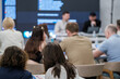 © Anton Gvozdikov - Audience listens attentively in workshop focusing on professional development and collaboration.