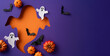 © ActionGP - A creative Halloween themed display featuring cutout elements of ghosts, bats, and pumpkins on a vibrant purple and orange background