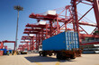 © Juno/Stocksy - Cargo truck and container in Shipping port