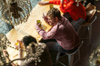 © Basil Pind/Stocksy - People Sitting at a Café Table with Drinks