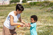 © Anna Fedorova/Stocksy - Caring Mother Applies Sunscreen to Child on a Sunny Day Outdoors