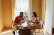 © BONNINSTUDIO/Stocksy - Manager hiring candidate to evaluate job seeker qualifications