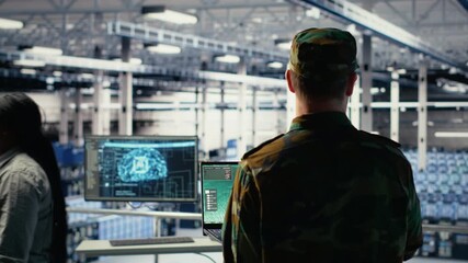 Poster - Military data center expert using ballistic missiles radar on laptop to watch for enemy threats. Army soldier in data center uses scanner tech to detect rockets launched by enemy troops, camera B