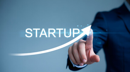 Businessman activating startup growth with upward arrow and digital interface