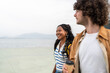 © Alvaro Lavin/Stocksy - Students walking by the sea enjoying a relaxing day