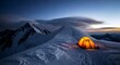 © StockShift - Illuminated tent on snowy mountain peak at dusk with climber in distance