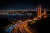 Golden Gate Bridge at night, city lights reflecting on water. Highway traffic trails