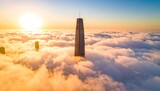 Sunrise over a skyscraper piercing a sea of clouds